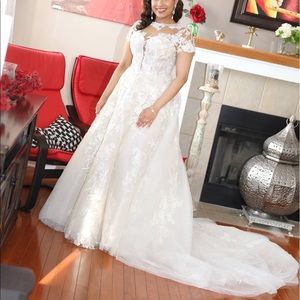 Lace wedding dress with train attached.